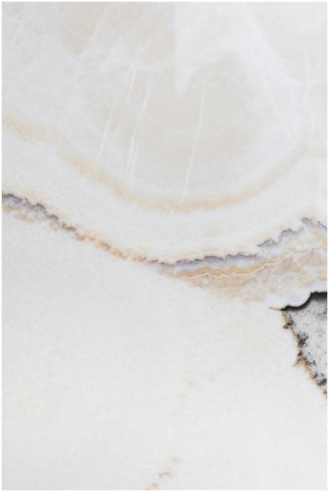 Close-up shot of a light marble texture showcasing
