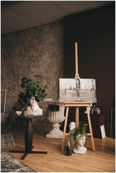 A creative art studio featuring a bust sculpture a