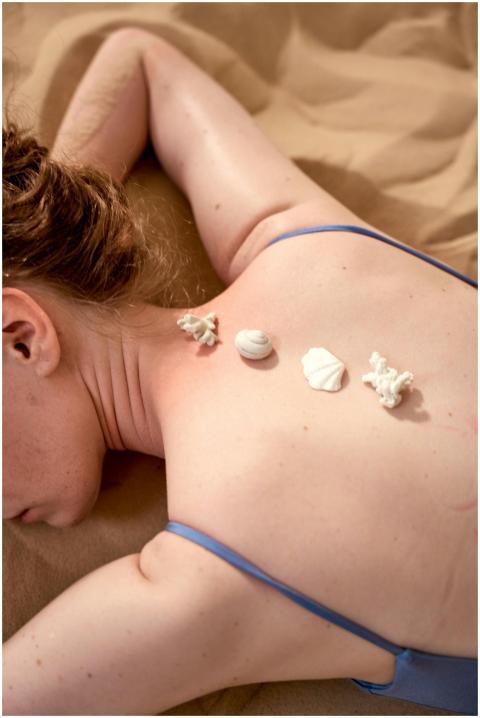 Close-up of seashells on skin in a conceptual spa