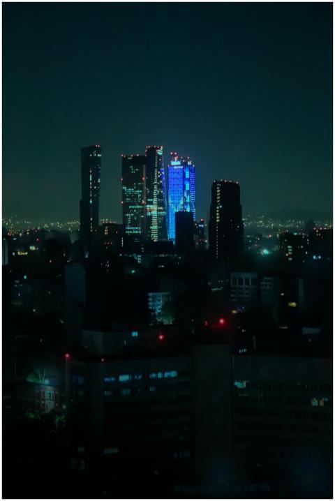 A stunning night view of modern skyscrapers in the