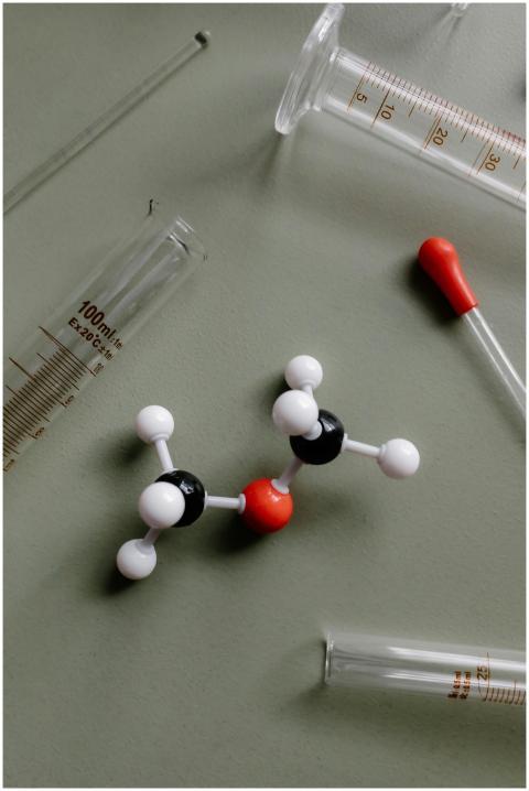 Close-up of a molecular model surrounded by labora