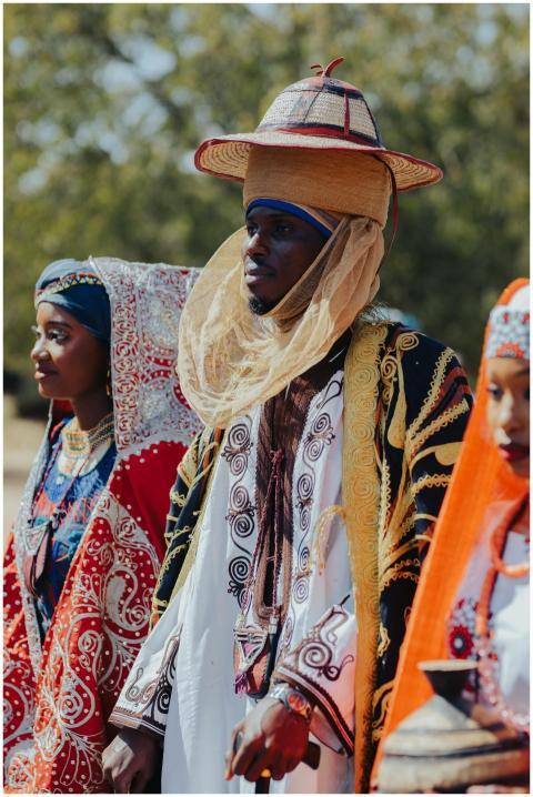 Vibrantly dressed individuals in traditional Afric