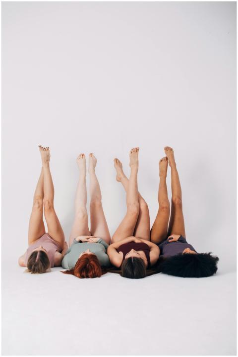 Four diverse women in underwear posing confidently