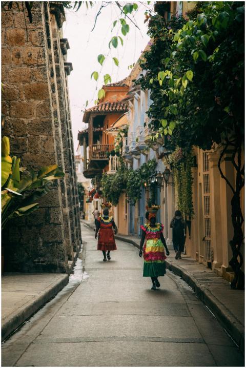 Colorful street scene in Cartagena, showcasing wom