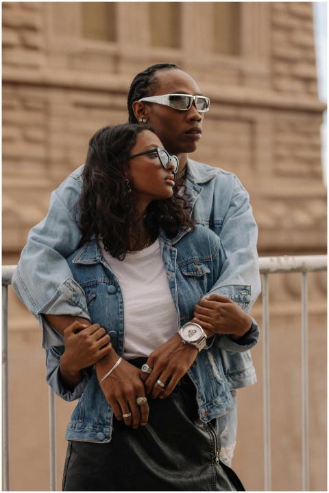 A fashionable couple in denim embraces, showcasing