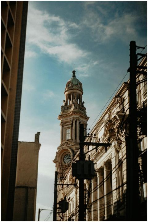 Classic architectural clock tower reaching into a