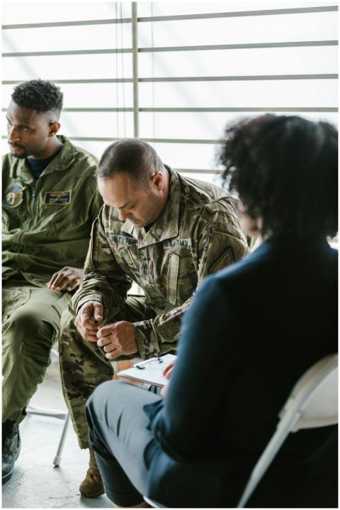 Military personnel in a group therapy session, foc