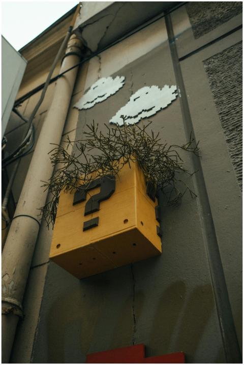 Street art featuring a yellow question block with