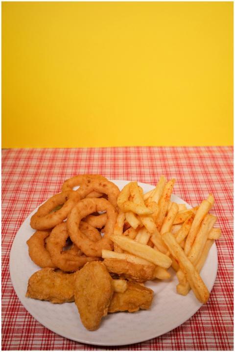 Crispy onion rings, French fries, and nuggets serv