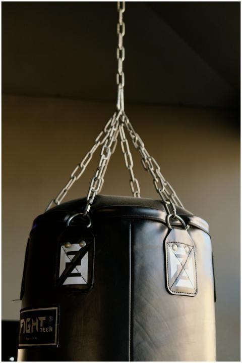 Close-up of a black punching bag with metal chains