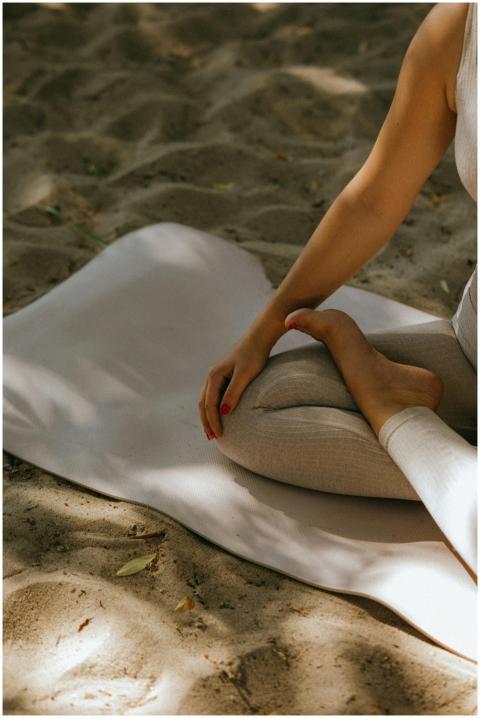Peaceful yoga practice on sandy beach, embodying r