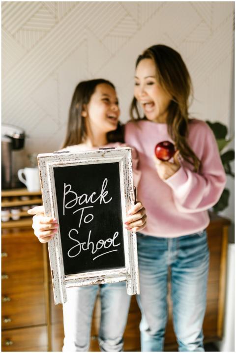 Mother and daughter joyfully celebrating back to s