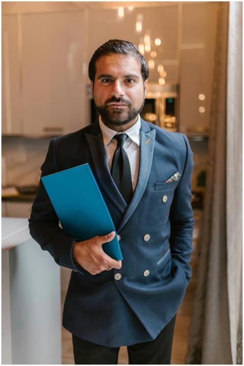 Confident businessman in elegant attire holding a