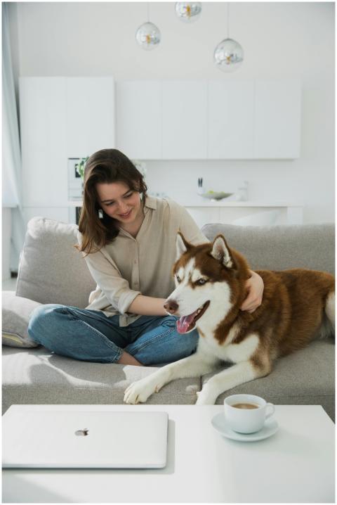 Young woman relaxing on the couch with her Siberia