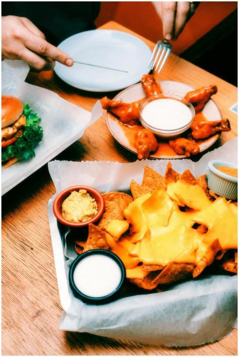 Delicious nachos topped with melted cheese served