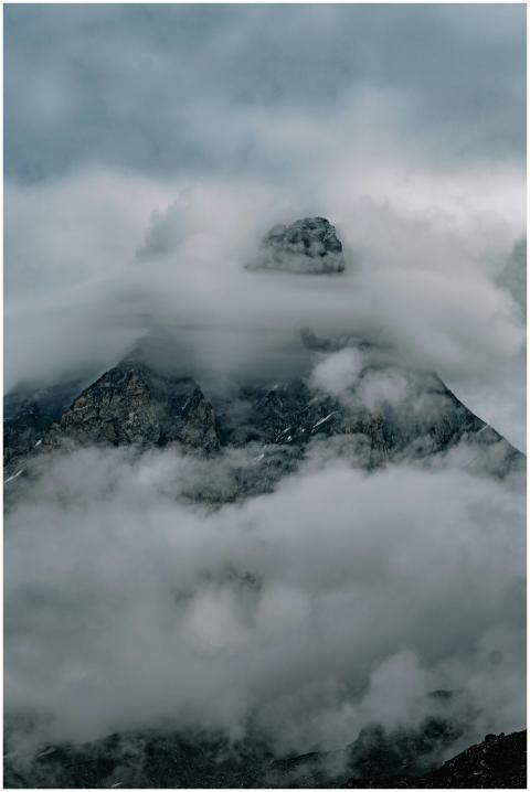 A breathtaking view of a mountain peak wrapped in