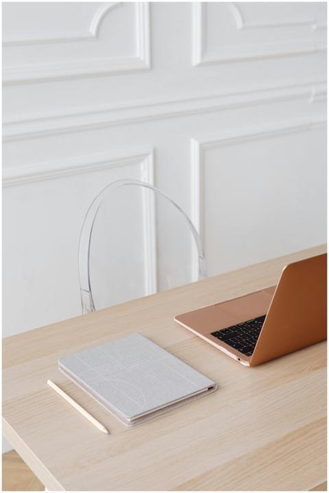 Modern minimalist workspace featuring a laptop and