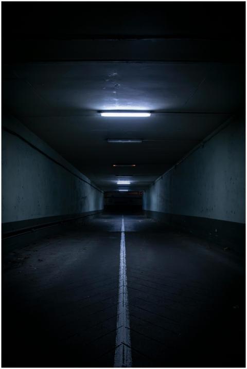 Moody view of a modern underground tunnel illumina