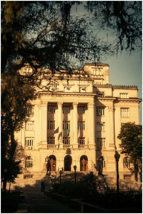 A majestic building with neoclassical columns surr