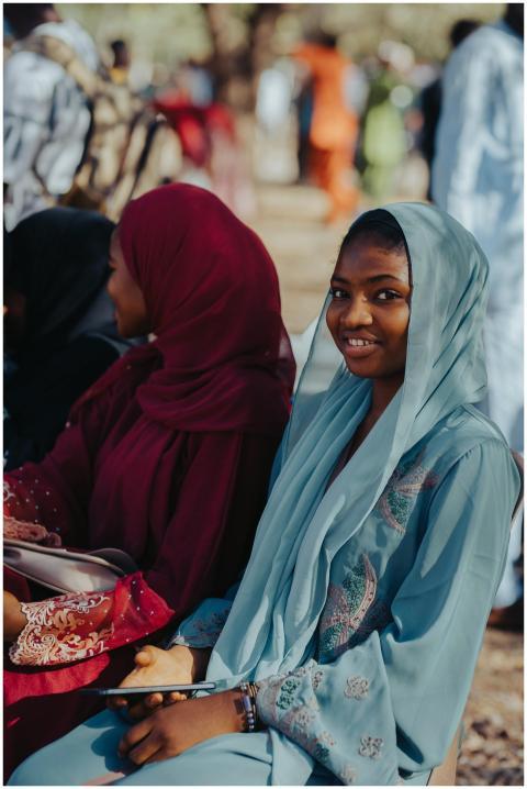 Radiant young women in colorful traditional attire