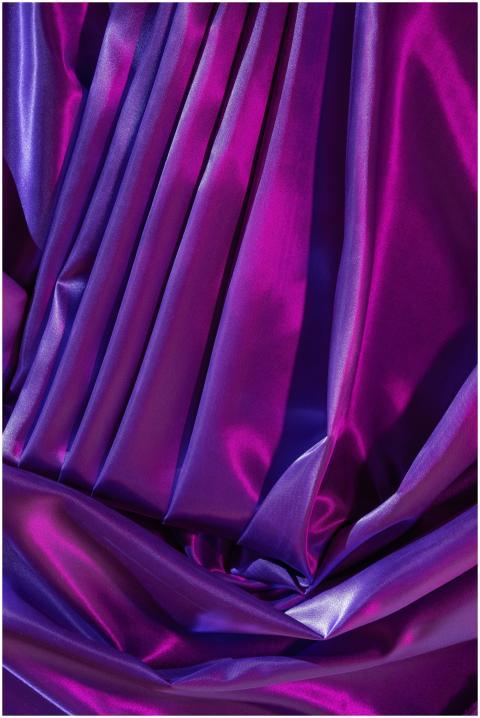 Close-up of vibrant, colorful silk fabric with lux