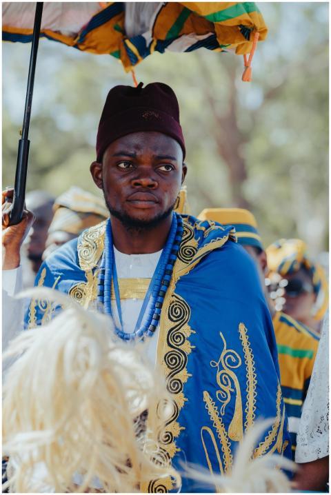 Man in traditional African attire participating in