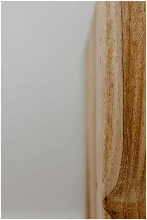 Close-up view of a smooth wooden surface capturing