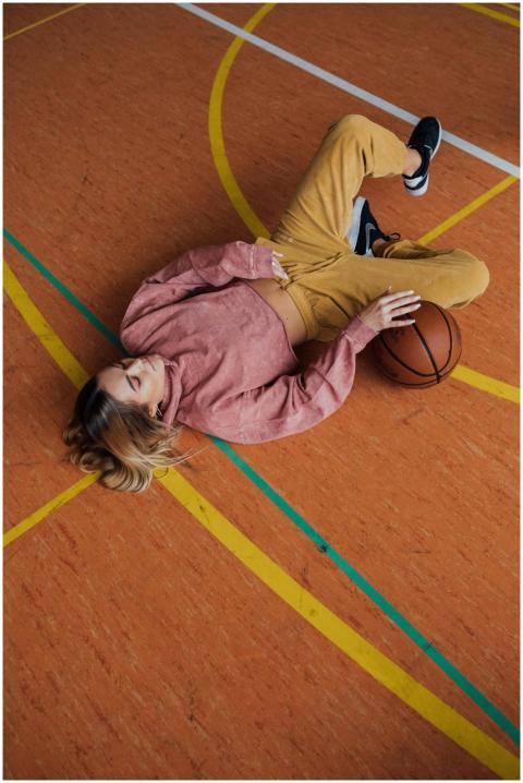 Casual portrait of a young woman laying on a baske