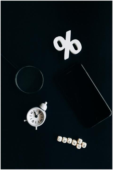 Stylish composition of clock, symbols, and text re