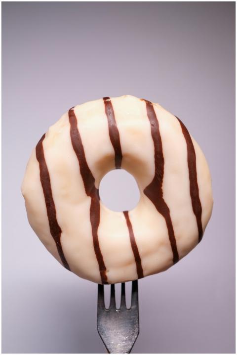 Appetizing traditional donut with white and chocol
