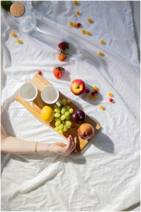 Top view of crop unrecognizable female lying on wh