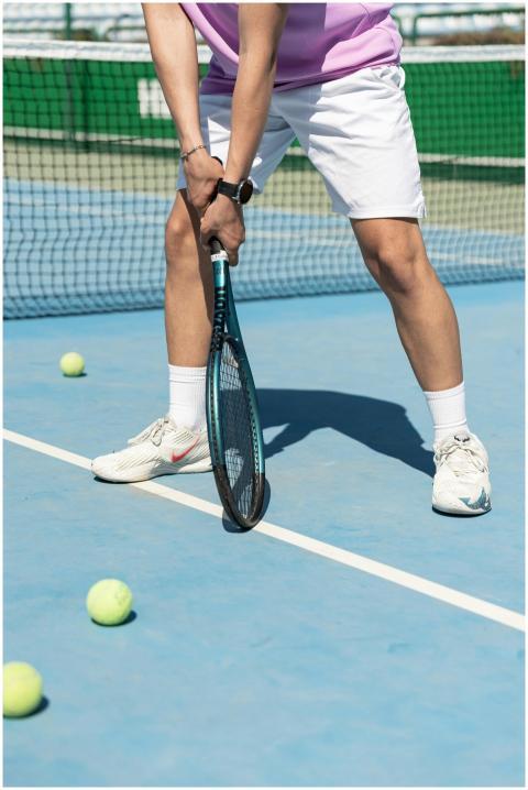 Man in sportswear holding a racket, ready to play