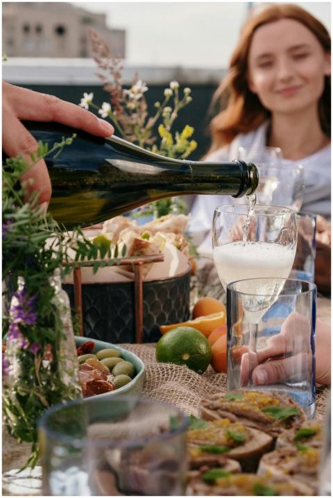 A lively outdoor brunch with friends enjoying wine