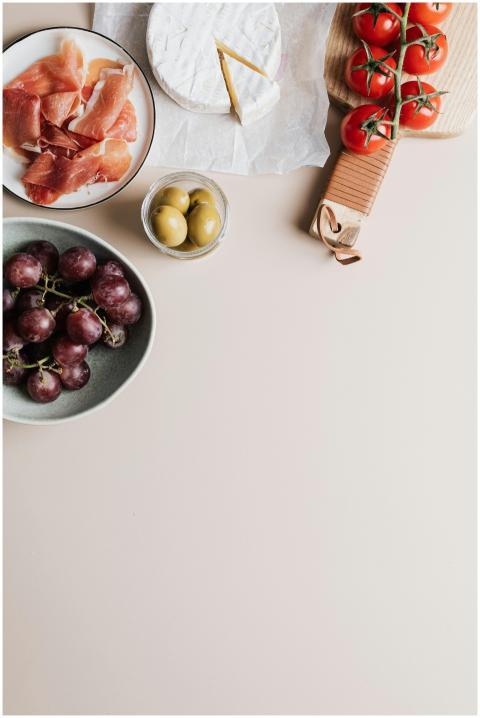 Gourmet platter with camembert, prosciutto, tomato