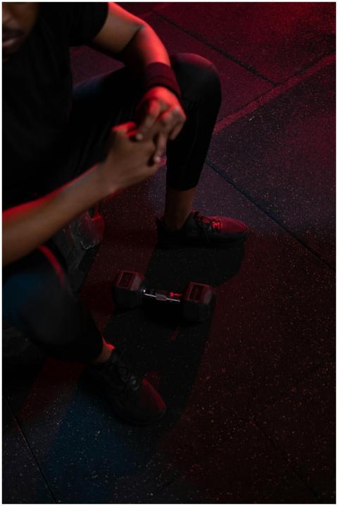 High-angle view of a man resting in a gym beside a