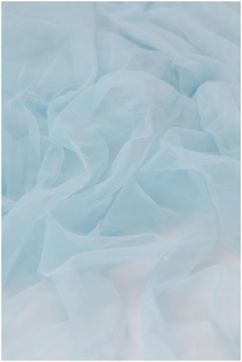 Soft pastel blue silk fabric creating an elegant a