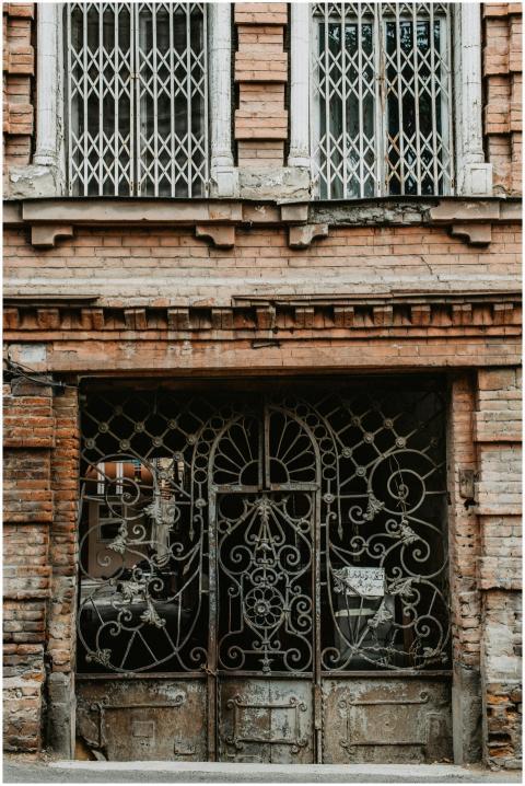 A detailed view of a rustic iron gate set in histo