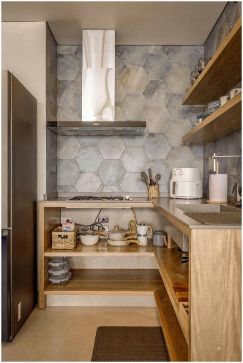 A cozy Scandinavian style kitchen with wooden shel