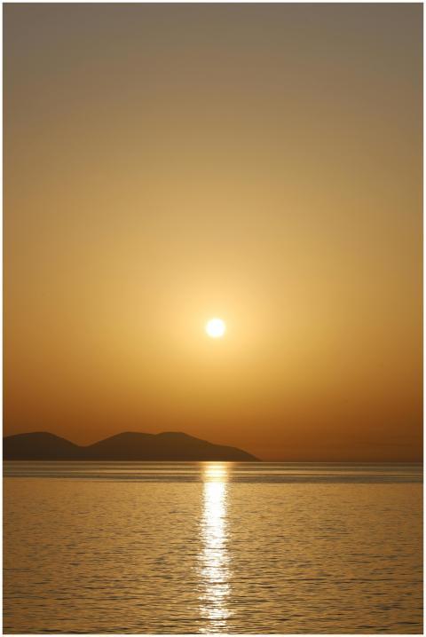 Serene sunset view with golden hues reflecting on