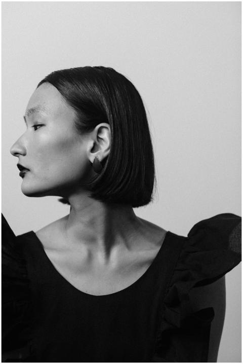 Striking black and white side profile of a stylish