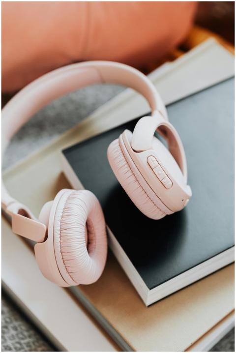 Close-up of stylish wireless headphones on a stack