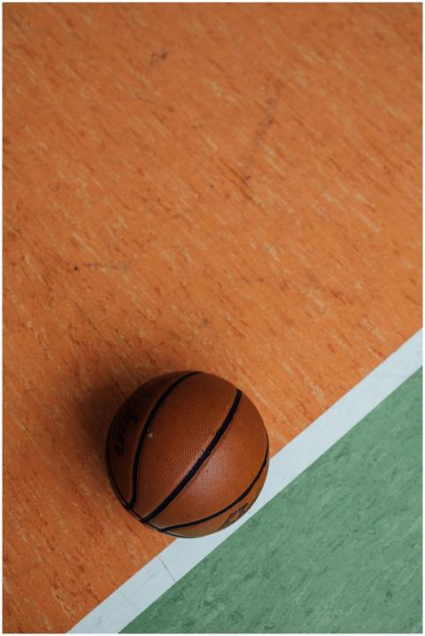Close-up of a basketball on a vibrant indoor court