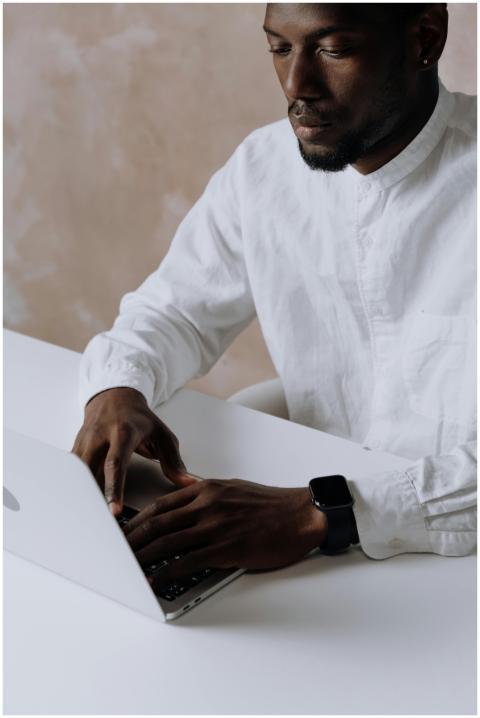 Business professional working on a laptop in an of