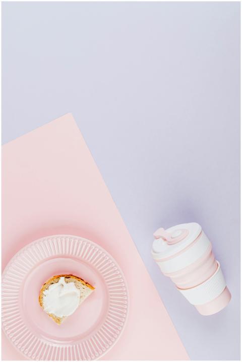 Minimalist setup with a slice of cake and a pink t