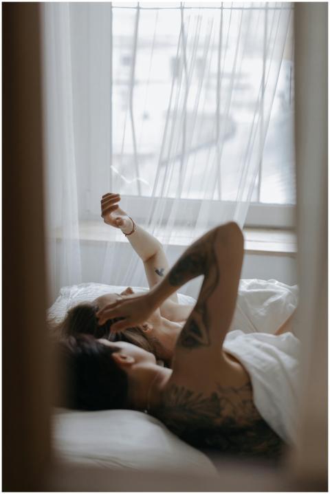 A loving couple with tattoos enjoys a relaxed morn