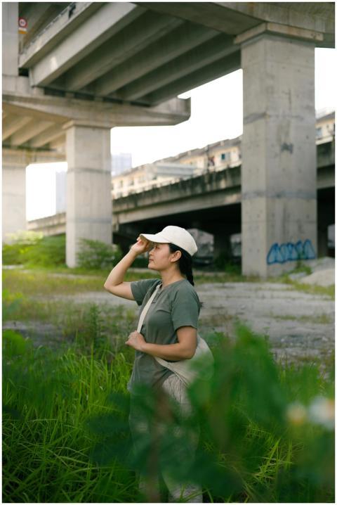 Woman Exploring Urban Underpass