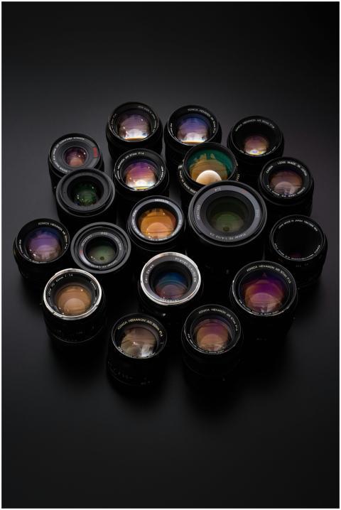 Diverse collection of camera lenses arranged on a