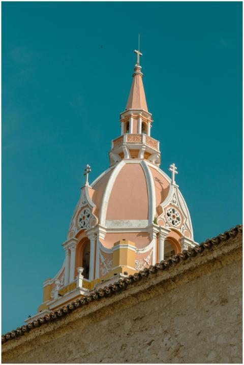 Photograph of a historic pink and white dome with
