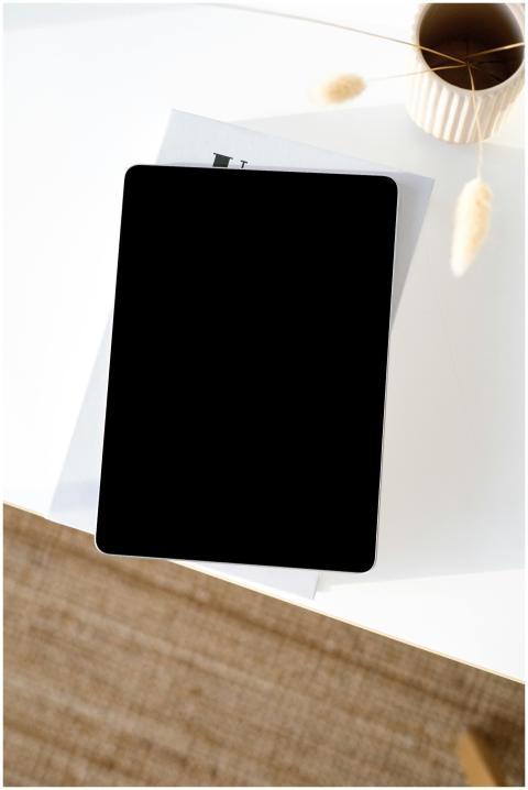 Overhead view of a tablet on a stylish, minimalist