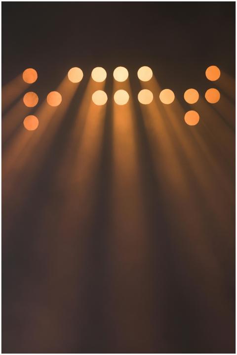 Abstract image of multiple spotlights casting brig
